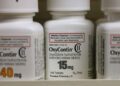 overdose deaths. Bottles of Purdue Pharma L.P. OxyContin medication sit on a pharmacy shelf in Prov...