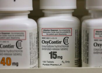 overdose deaths. Bottles of Purdue Pharma L.P. OxyContin medication sit on a pharmacy shelf in Prov...