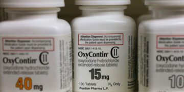 overdose deaths. Bottles of Purdue Pharma L.P. OxyContin medication sit on a pharmacy shelf in Prov...