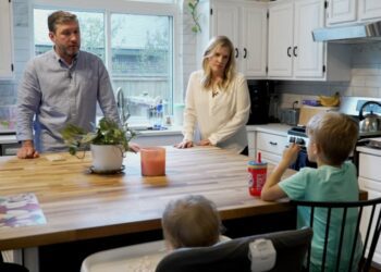 Kaitlyn Kash and her husband, Cory, at home with their two children.