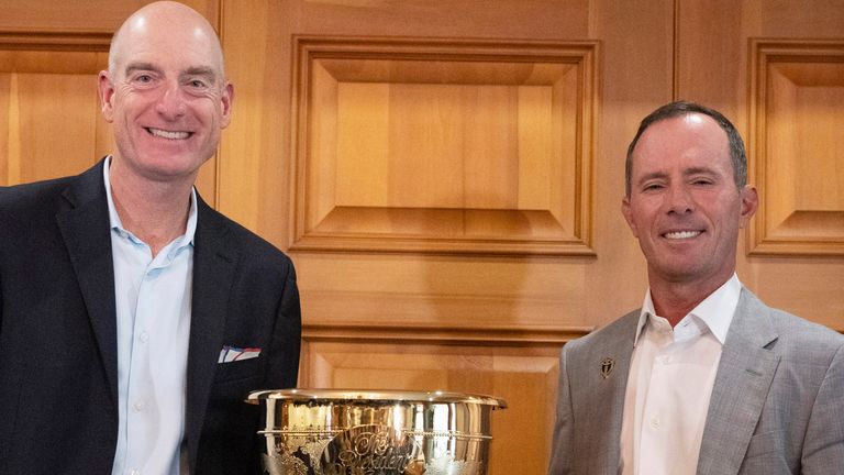 2024 Presidents Cup captains Mike Weir, right, for the international team, and Jim Furyk, for the U.S. team, pose for photos Tuesday, Sept. 12, 2023, at Royal Montreal Golf Club in Ile-Bizard, Quebec. (Ryan Remiorz/The Canadian Press via AP)