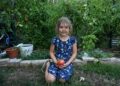 Naomi, 7, shows off the family's prized garden that is full of vegetables at her home in Denver on Sept. 17, 2024. (Photo by Helen H. Richardson/The Denver Post)