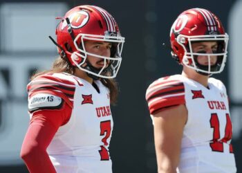 Utah Utes quarterback Cameron Rising (7) and Utah Utes quarterback Sam Huard (14) watch warm ups agaistn USU in Logan on Saturday, Sept. 14, 2024.