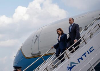 Vice President Kamala Harris and her husband second gentleman Doug Emhoff arrive at Philadelphia International Airport for a campaign event at the Liacouras Center at Temple University on August 6 in Philadelphia.