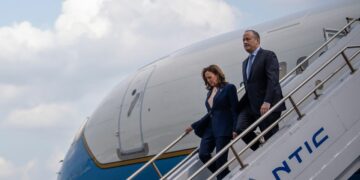 Vice President Kamala Harris and her husband second gentleman Doug Emhoff arrive at Philadelphia International Airport for a campaign event at the Liacouras Center at Temple University on August 6 in Philadelphia.