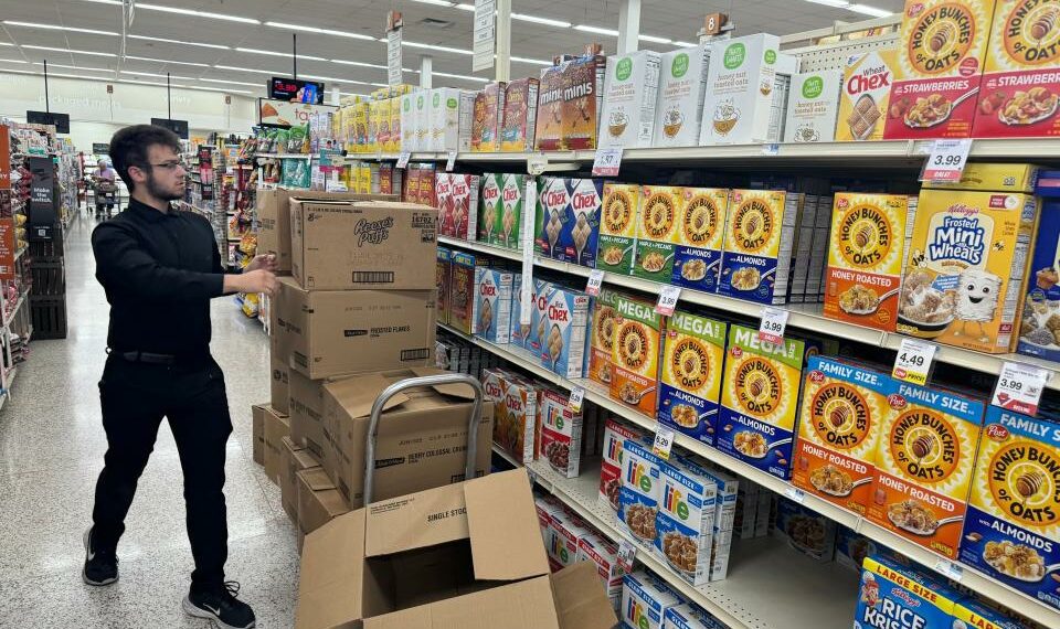 A Hy-Vee employee stocks cereal boxes on the shelves at the 26th Street location in Sioux Falls, S.D. on Sept. 6, 2024. Initiated Measure 28 seeks to eliminate the state sales tax on groceries in South Dakota, but questions about the measure persist.