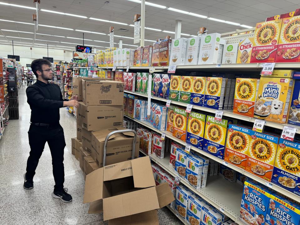 A Hy-Vee employee stocks cereal boxes on the shelves at the 26th Street location in Sioux Falls, S.D. on Sept. 6, 2024. Initiated Measure 28 seeks to eliminate the state sales tax on groceries in South Dakota, but questions about the measure persist.