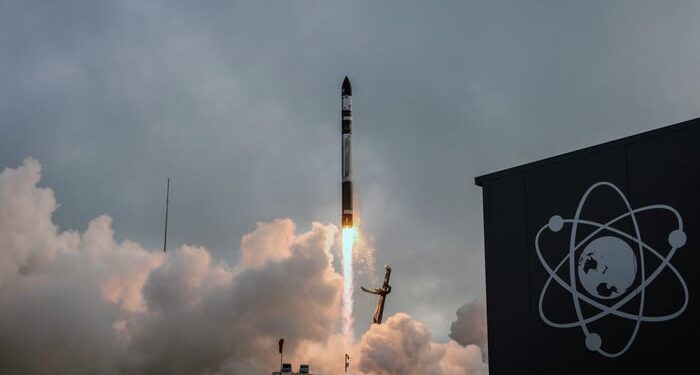 Rocket Lab's Electron rocket taking off from its launch complex.