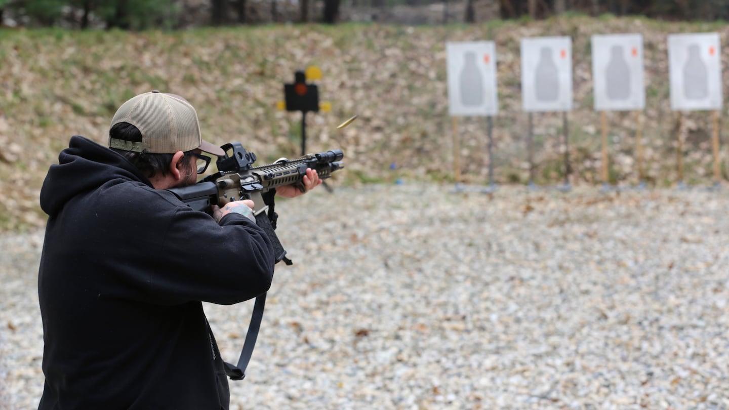 A shooter fired a rifle at a target at Slate Ridge Vermont, an unpermitted gun range and firearms training center, April 17, 2021 in West Pawlet, Vt., during what organizers called a Second Amendment Day Picnic.