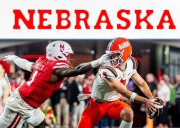 Sep 20, 2024; Lincoln, Nebraska, USA; Nebraska Cornhuskers defensive lineman Jimari Butler (1) grabs the face mask of Illinois Fighting Illini quarterback Luke Altmyer (9) during the second quarter at Memorial Stadium. Mandatory Credit: Dylan Widger-Imagn Images