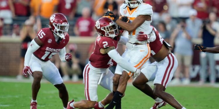 Oklahoma Sooners defensive back Billy Bowman Jr. (2) brings down Tennessee Volunteers wide receiver Chris Brazzell II (17) during a college football game between the University of Oklahoma Sooners (OU) and the Tennessee Volunteers at Gaylord Family - Oklahoma Memorial Stadium in Norman, Okla., Saturday, Sept. 21, 2024.