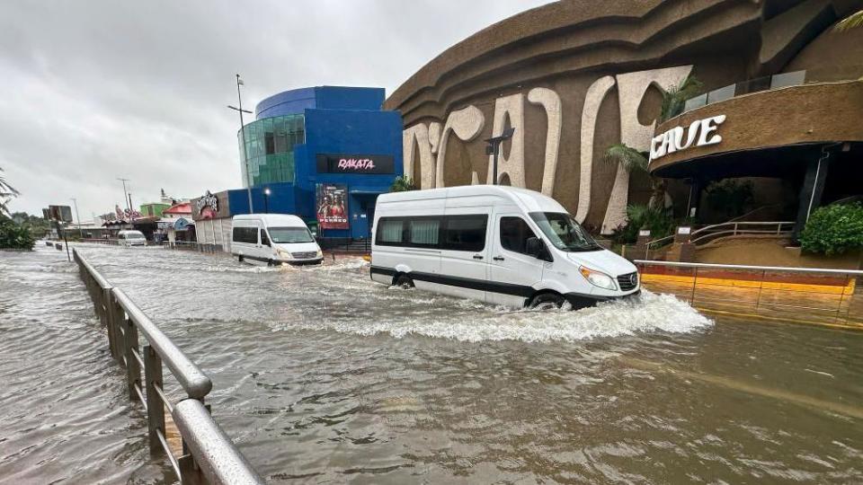 Cars cross a street flooded by Hurricane Helene in the beach resort of Cancun, Quintana Roo, Mexico, 25 September 2024. 