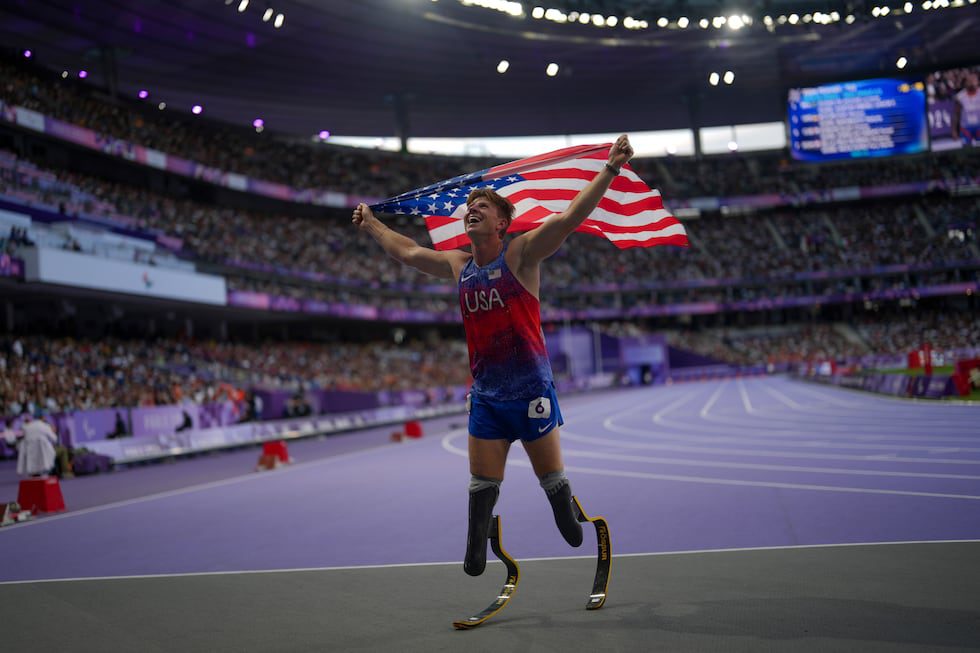 Hunter Woodhall from the U.S. celebrates after winning the men's 400 m. T62 final at the 2024...