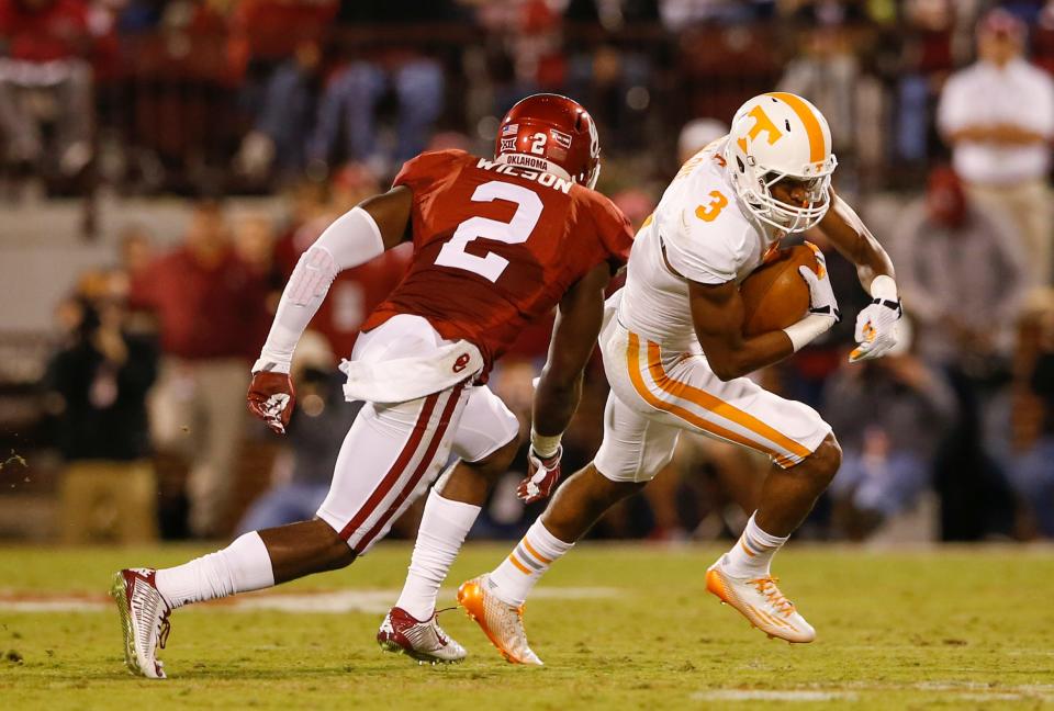 Sep 13, 2014; Norman, OK; Tennessee Volunteers wide receiver Josh Malone (3) runs with the ball as Oklahoma Sooners cornerback Julian Wilson (2) chases during the first half at Gaylord Family - Oklahoma Memorial Stadium. Mandatory Credit: Kevin Jairaj-USA TODAY Sports