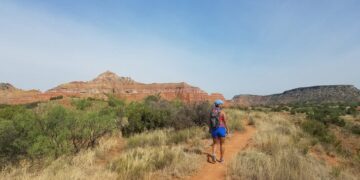 woman hiking at Palo Duro Canyon State Park