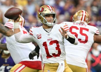 Sep 15, 2024; Minneapolis, Minnesota, USA; San Francisco 49ers quarterback Brock Purdy (13) throws a pass against the Minnesota Vikings during the first quarter U.S. Bank Stadium. Mandatory Credit: Jeffrey Becker-Imagn Images