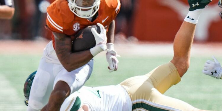 Texas running back Jaydon Blue will try anbd find room to run against a rugged Michigan defense. The Longhorns' ability to run power between the tackles could prove decisive in Saturday's game at Michigan.