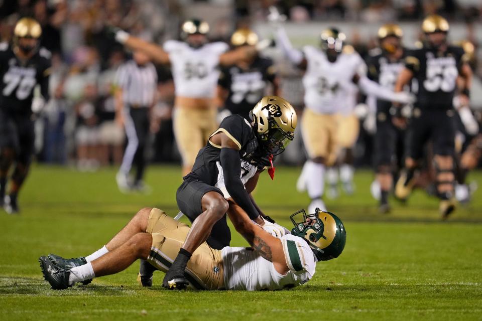 Sep 16, 2023; Boulder, Colorado, USA; Colorado State Rams defensive back Henry Blackburn (11) makes an interception on a pass intended for Colorado Buffaloes wide receiver Jimmy Horn Jr. (5) in the first quarter at Folsom Field. Mandatory: Andrew Wevers-USA TODAY Sports