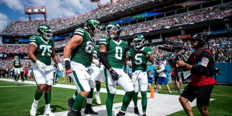 New York Jets running back Braelon Allen (0) celebrates his touchdown against the Tennessee Titans during the second quarter at Nissan Stadium in Nashville, Tenn., Sunday, Sept. 15, 2024.