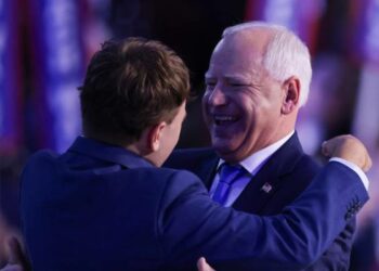 Democratic vice presidential nominee Tim Walz hugs his son, Gus Walz (Image: EPA/Justin Lane)