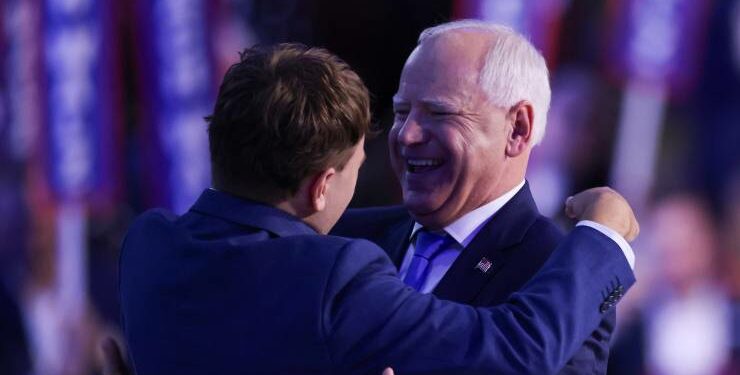 Democratic vice presidential nominee Tim Walz hugs his son, Gus Walz (Image: EPA/Justin Lane)