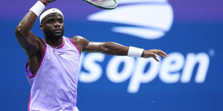 Frances Tiafoe of the United States returns a shot against Alexei Popyrin of Australia during their Men's Singles Fourth Round match on Day Seven of the 2024 US Open at USTA Billie Jean King National Tennis Center