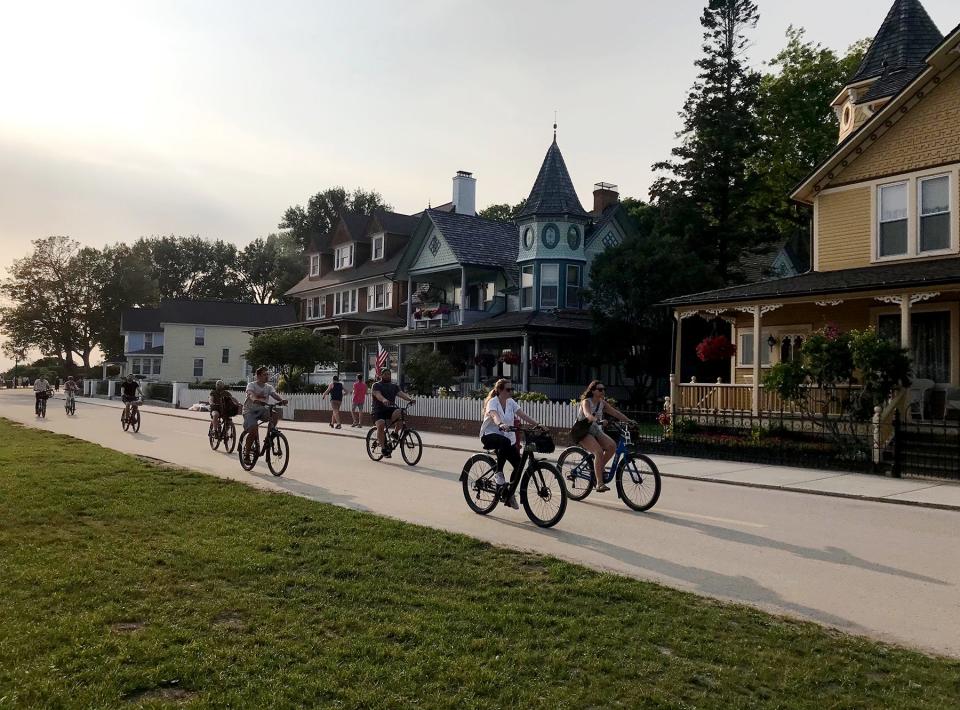 People ride bicycles on Mackinac Island on Friday, July 26, 2024.