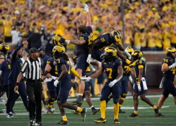 Michigan players celebrate a stop on fourth down against the...