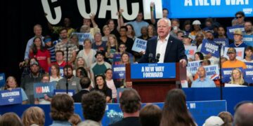 Democratic vice presidential nominee, Minnesota Governor Tim Walz, delivers remarks at an election campaign event in Superior, Wisconsin, on September 14, 2024 (REUTERS)