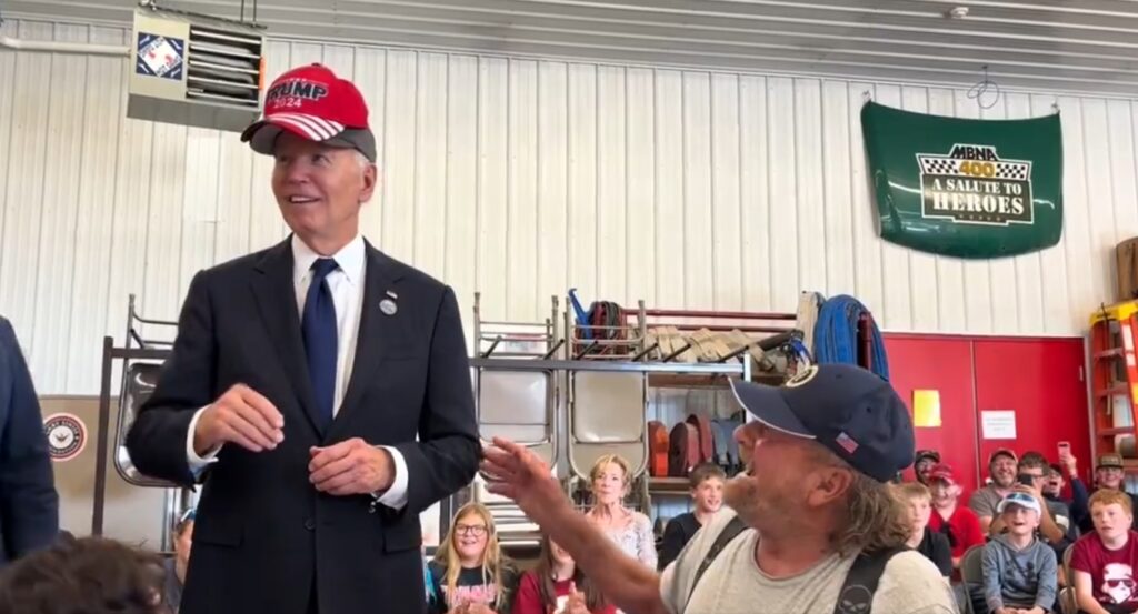 Watch Biden Rub Elbows With Trump Supporter In MAGA Hat