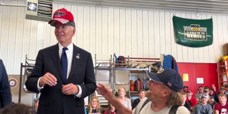 Watch Biden Rub Elbows With Trump Supporter In MAGA Hat