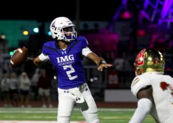 IMG Academy's Ty Hawkins (2) passes the ball during the third quarter of the Battle at the Beach football game against Bergen Catholic at Carey Stadium in Ocean City, N.J., Thursday, Aug. 29, 2024.