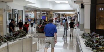 Shoppers stroll through Kenwood Towne Centre near the Apple Store on Thursday, June 22, 2017. The Enquirer/Shae Combs