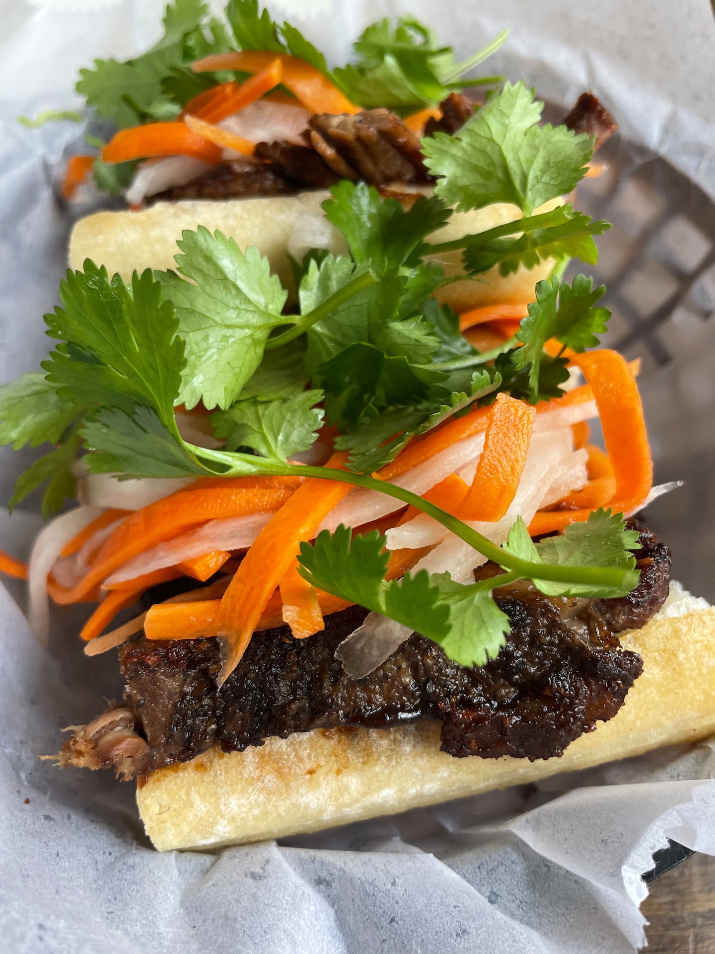 Banh mi from Purslane, a restaurant in Wakefield, Rhode Island, which uses chili crisp for heat. 