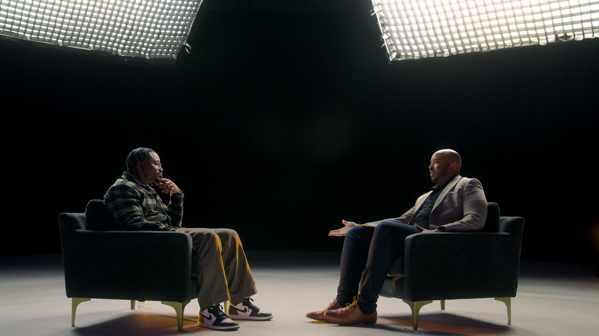 Ryan Coogler and Justin Simien seated in chairs across from each other.