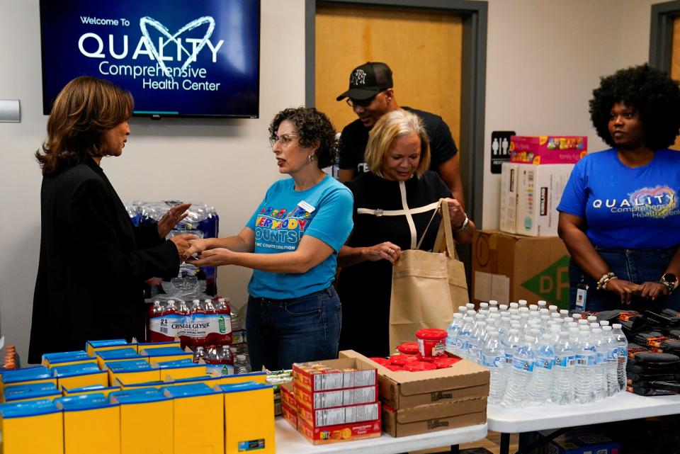 Volunteers ‌at Charlotte donation center gather for emergency package assembly after Hurricane Helene.