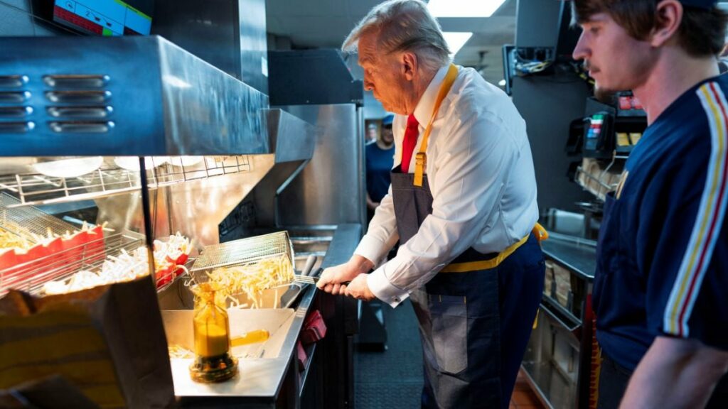 Republican presidential nominee and former US President Donald Trump works behind the counter during a visit to McDonalds in Feasterville-Trevose, Pennsylvania, US, October 20, 2024. File Image/Reuters