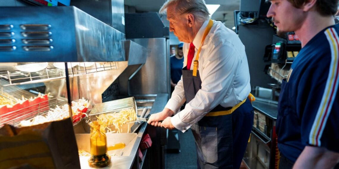 Republican presidential nominee and former US President Donald Trump works behind the counter during a visit to McDonalds in Feasterville-Trevose, Pennsylvania, US, October 20, 2024. File Image/Reuters