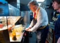 Republican presidential nominee and former US President Donald Trump works behind the counter during a visit to McDonalds in Feasterville-Trevose, Pennsylvania, US, October 20, 2024. File Image/Reuters