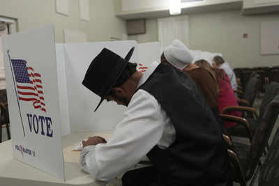 US Election 2024: An Amish couple⁤ casting their vote