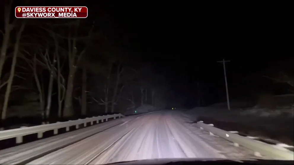 Kentucky crews work tirelessly clearing roads covered by ⁢accumulating snow amidst dangerous driving ⁢conditions ⁣captured on video‌ in ​Daviess County.